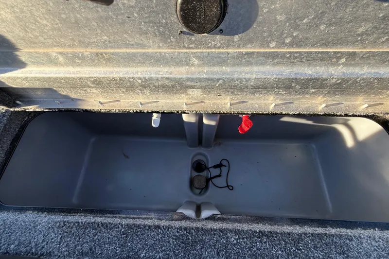 Slide: The Image of 2020 Tracker Pro Team 175 livewell interior with drain plug and aerator. - 36