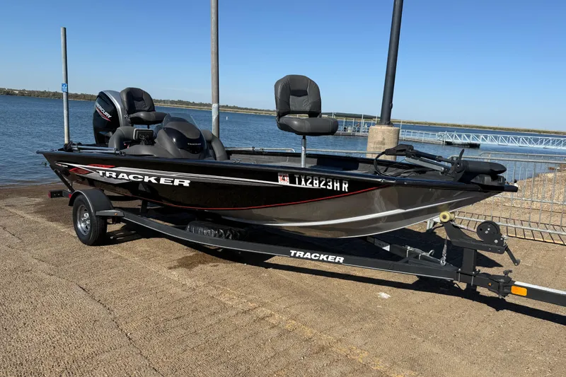 Slide: The Image of 2020 Tracker Pro Team 175 boat on trailer by the water. - 38