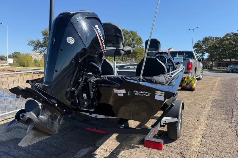 Slide: The Image of 2020 Tracker Pro Team 175 boat on trailer, featuring a Mercury outboard motor. - 48