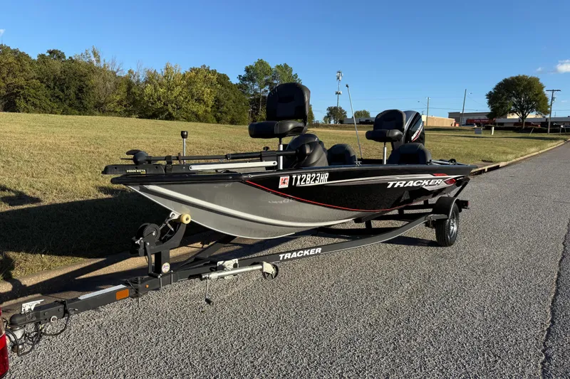 Slide: The Image of 2020 Tracker Pro Team 175 boat on trailer, parked on a sunny road. - 5