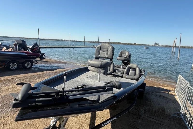 Slide: The Image of 2020 Tracker Pro Team 175 boat at lakeside launch, featuring Minn Kota trolling motor. - 52