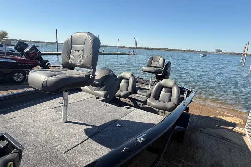 Slide: The Image of 2020 Tracker Pro Team 175 boat with seating, docked by a lake. - 53