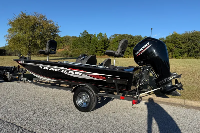 Slide: The Image of 2020 Tracker Pro Team 175 boat with Mercury engine on trailer, parked outdoors. - 7