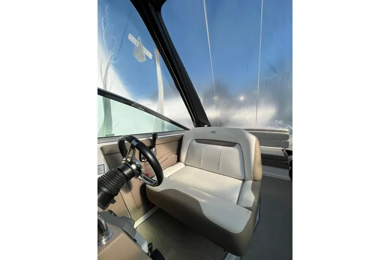 Slide: The Image of Compact kitchen area in 2017 Regal 28 Express boat with microwave, sink, and stove. - 11