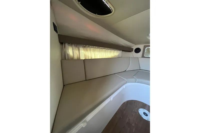 Slide: The Image of 2017 Regal 28 Express boat interior with open storage compartment. - 16