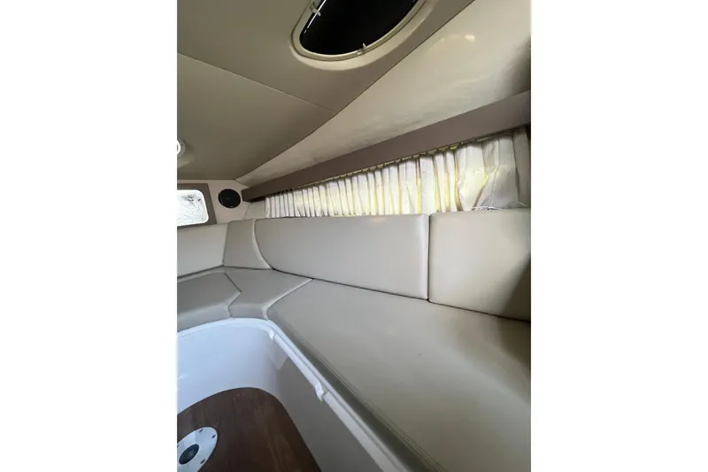 Slide: The Image of 2017 Regal 28 Express boat interior with seating and storage area. - 17