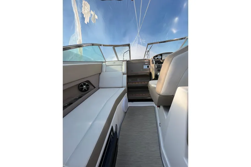 Slide: The Image of 2017 Regal 28 Express boat interior with beige seating and modern design. - 19