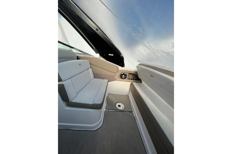 Slide: The Image of 2017 Regal 28 Express cabin interior with wooden steps and compact sleeping area. - 23