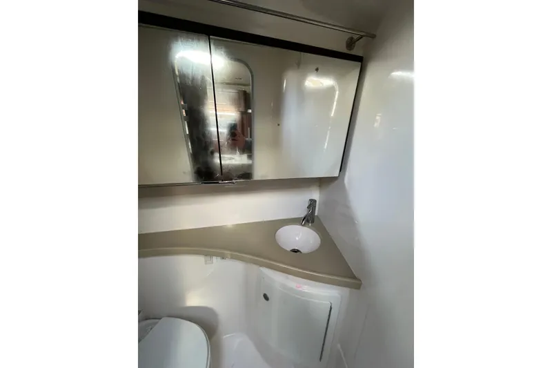 Slide: The Image of 2017 Regal 28 Express boat helm with Garmin navigation system and steering wheel. - 8