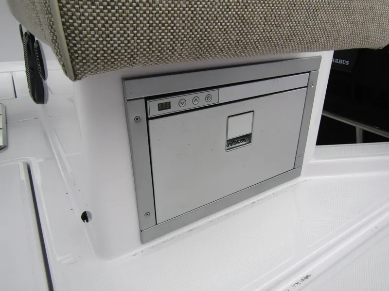 Slide: The Image of 2024 Axopar 37 Sun Top boat interior with built-in storage compartment. - 25