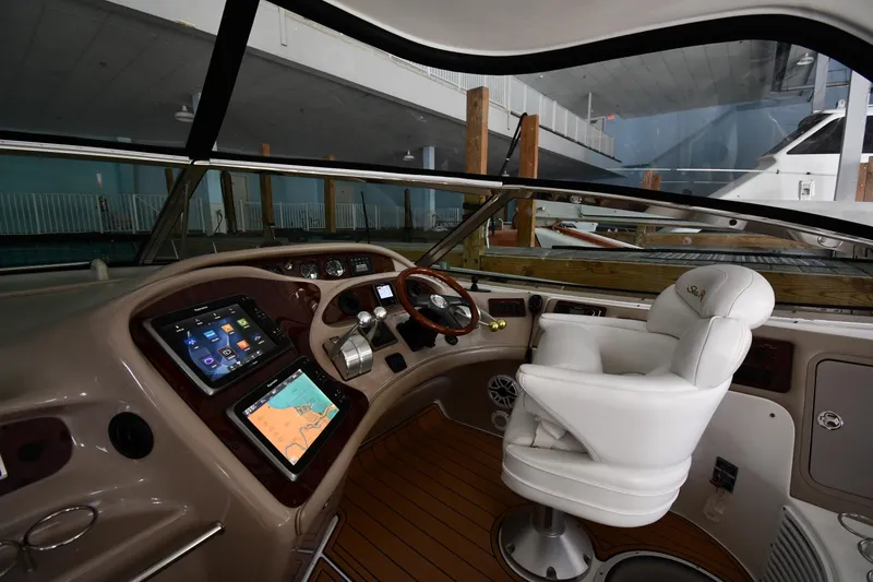 Slide: The Image of Luxurious helm of 2001 Sea Ray 540 Sundancer yacht with modern navigation equipment. - 11