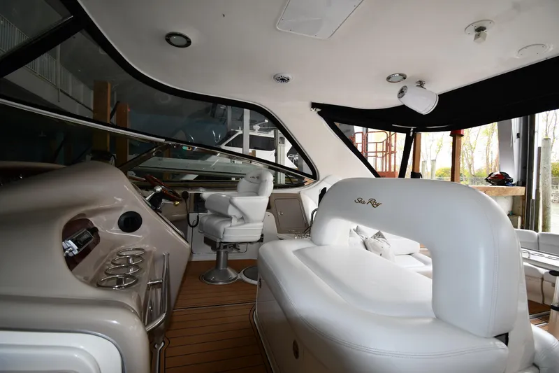 Slide: The Image of Interior of 2001 Sea Ray 540 Sundancer yacht with luxurious seating and helm. - 16