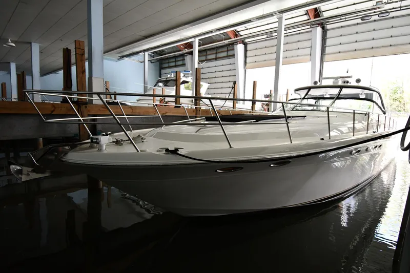 Slide: The Image of 2001 Sea Ray 540 Sundancer yacht docked in a marina. - 2