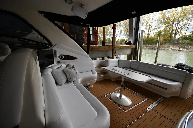 Slide: The Image of Luxurious 2001 Sea Ray 540 Sundancer yacht interior with plush seating and elegant table. - 20