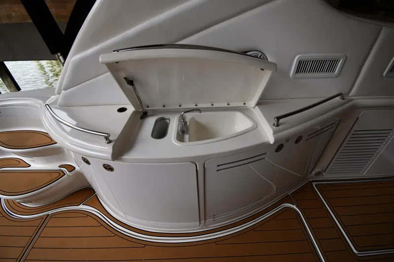 Slide: The Image of 2001 Sea Ray 540 Sundancer yacht interior with sink and teak flooring. - 21
