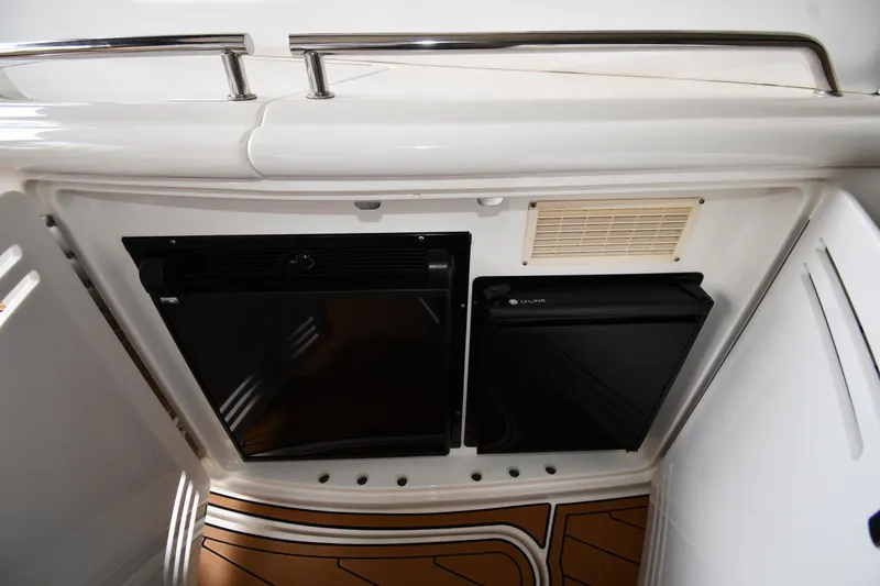 Slide: The Image of 2001 Sea Ray 540 Sundancer yacht interior with dual refrigerators and sleek design. - 22