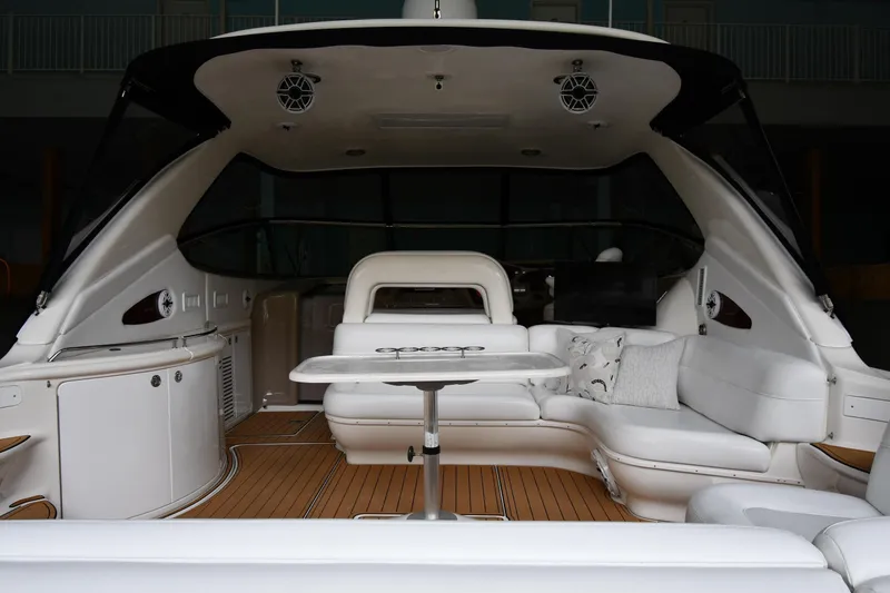 Slide: The Image of 2001 Sea Ray 540 Sundancer yacht interior with white seating and wooden flooring. - 29