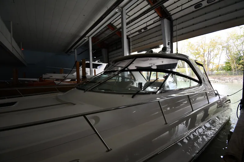 Slide: The Image of 2001 Sea Ray 540 Sundancer yacht docked in a covered marina. - 3