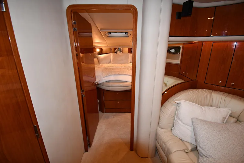 Slide: The Image of Luxurious interior of 2001 Sea Ray 540 Sundancer yacht with cozy bedroom and seating area. - 30