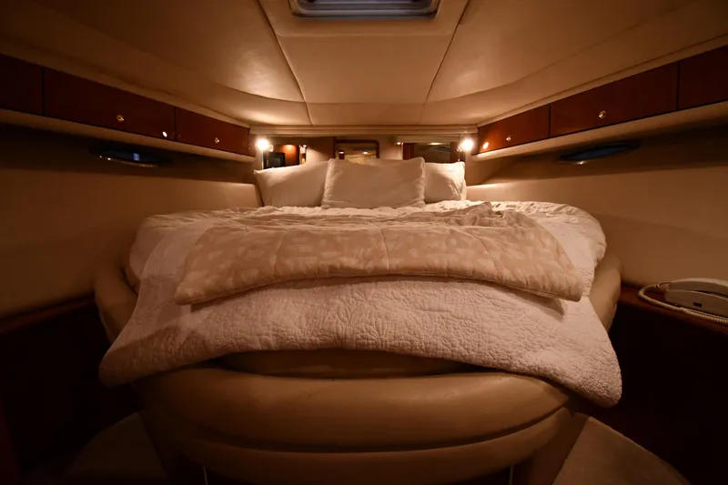 Slide: The Image of Luxurious cabin interior of 2001 Sea Ray 540 Sundancer yacht with cozy bedding. - 31