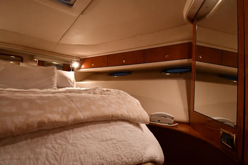 Slide: The Image of Luxurious cabin interior of 2001 Sea Ray 540 Sundancer yacht with cozy bedding. - 32