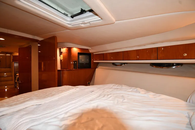 Slide: The Image of Luxurious interior of 2001 Sea Ray 540 Sundancer yacht with cozy bedroom. - 33