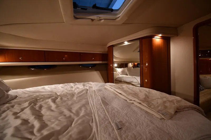 Slide: The Image of Luxurious cabin interior of 2001 Sea Ray 540 Sundancer yacht with cozy bedding. - 34