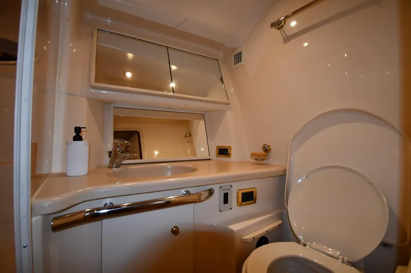 Slide: The Image of Luxurious bathroom in 2001 Sea Ray 540 Sundancer yacht, featuring modern fixtures and ample lighting. - 36