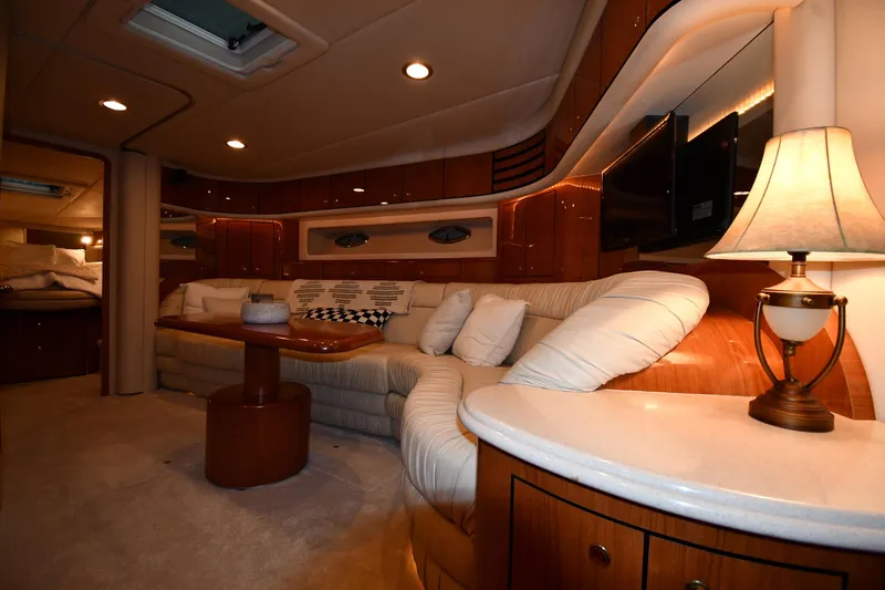 Slide: The Image of Luxurious interior of 2001 Sea Ray 540 Sundancer yacht with plush seating and elegant lighting. - 38