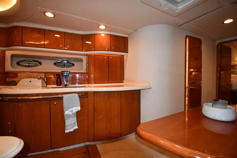 Slide: The Image of Luxurious interior of 2001 Sea Ray 540 Sundancer yacht with wooden cabinetry and modern amenities. - 39