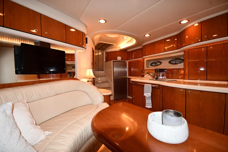 Slide: The Image of Luxurious interior of 2001 Sea Ray 540 Sundancer yacht with elegant wood finishes. - 40