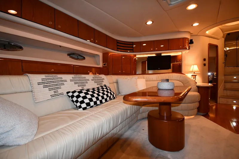 Slide: The Image of Luxurious interior of 2001 Sea Ray 540 Sundancer yacht with elegant seating and wooden accents. - 41