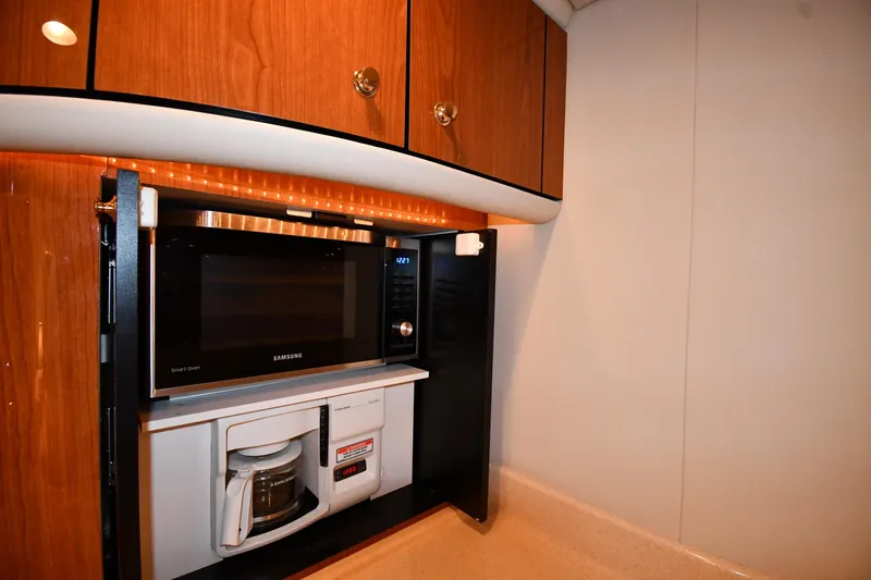 Slide: The Image of 2001 Sea Ray 540 Sundancer kitchen with Samsung microwave and coffee maker. - 46