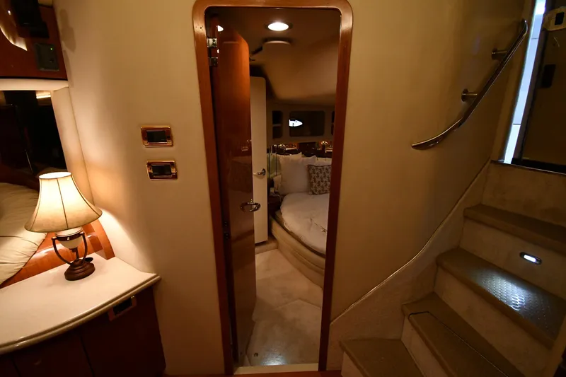 Slide: The Image of Interior of 2001 Sea Ray 540 Sundancer yacht, featuring cozy cabin and elegant lighting. - 48