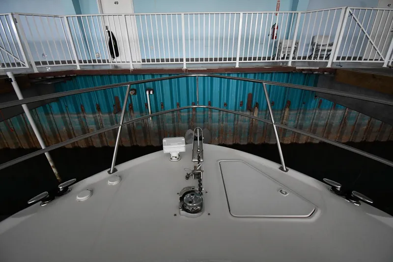 Slide: The Image of Bow view of 2001 Sea Ray 540 Sundancer docked indoors. - 5