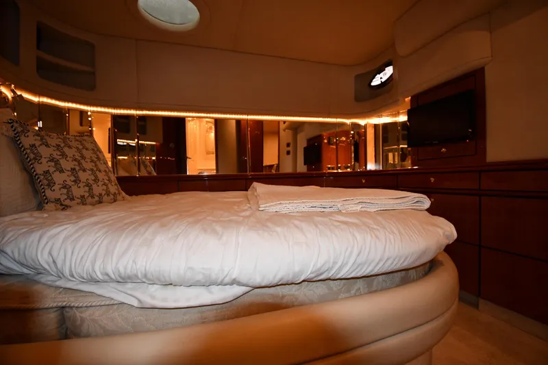 Slide: The Image of Luxurious bedroom interior of 2001 Sea Ray 540 Sundancer yacht with elegant bedding. - 50