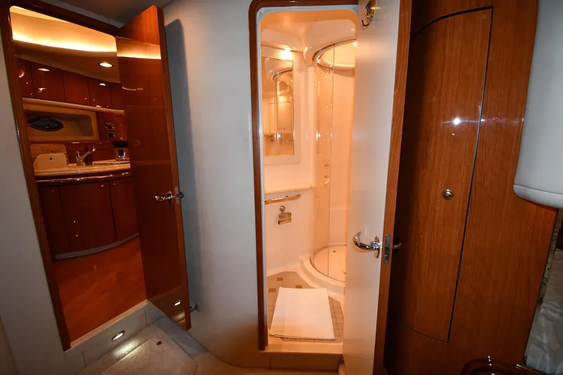 Slide: The Image of Luxurious bathroom interior of 2001 Sea Ray 540 Sundancer yacht, featuring wood accents and modern amenities. - 52