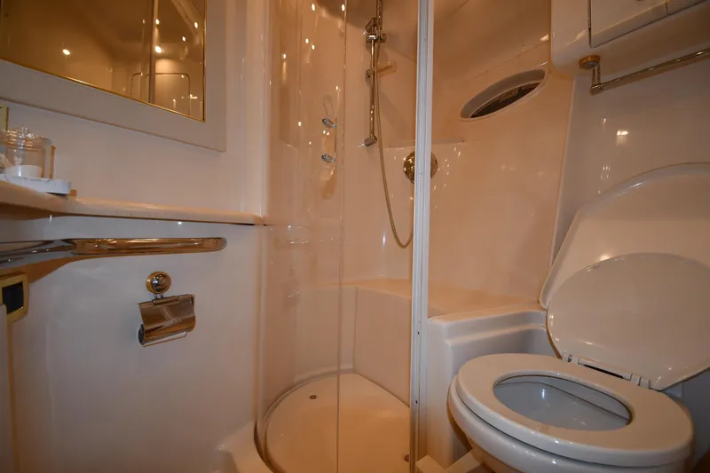 Slide: The Image of Bathroom interior of 2001 Sea Ray 540 Sundancer yacht, featuring shower and toilet. - 54