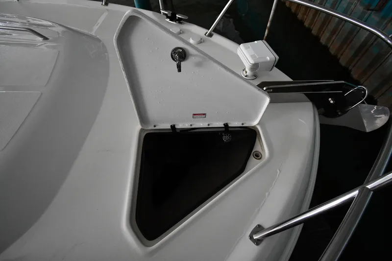 Slide: The Image of 2001 Sea Ray 540 Sundancer boat deck with open storage compartment. - 6
