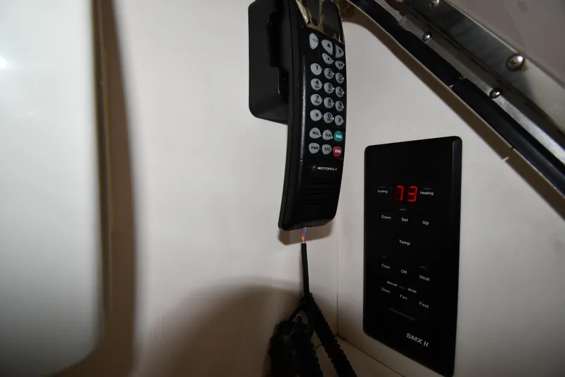 Slide: The Image of Control panel and Motorola phone in 2001 Sea Ray 540 Sundancer yacht. - 60