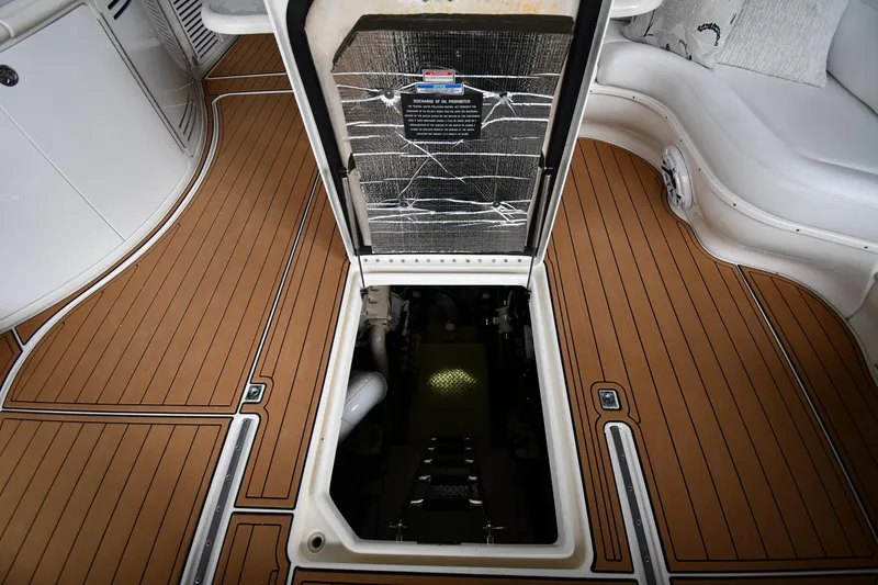Slide: The Image of Engine compartment access on 2001 Sea Ray 540 Sundancer yacht with teak flooring. - 61