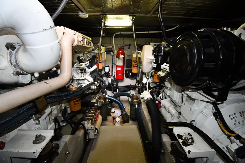 Slide: The Image of Engine room of 2001 Sea Ray 540 Sundancer yacht, showcasing mechanical components and systems. - 62