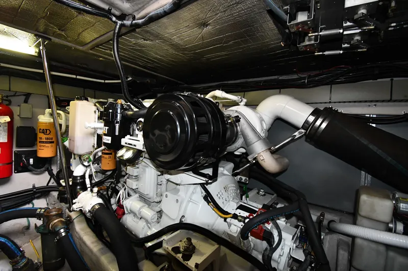 Slide: The Image of Engine room of 2001 Sea Ray 540 Sundancer with visible CAT components and fire extinguisher. - 63