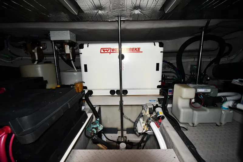 Slide: The Image of Engine room of 2001 Sea Ray 540 Sundancer with Westerbeke generator and various mechanical components. - 67