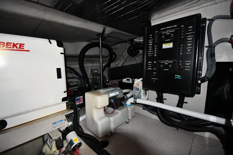 Slide: The Image of Engine room of 2001 Sea Ray 540 Sundancer with control panel and equipment. - 68