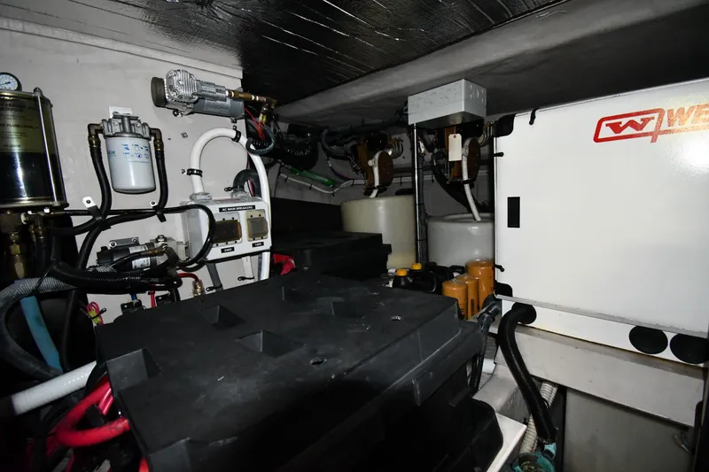 Slide: The Image of Engine room of 2001 Sea Ray 540 Sundancer with mechanical components and wiring. - 69