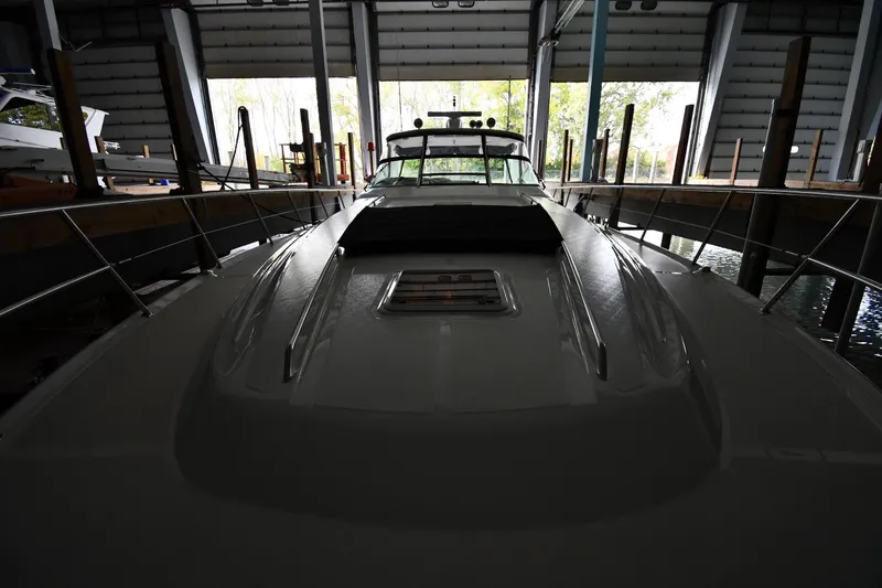 Slide: The Image of 2001 Sea Ray 540 Sundancer yacht docked in a covered marina. - 7