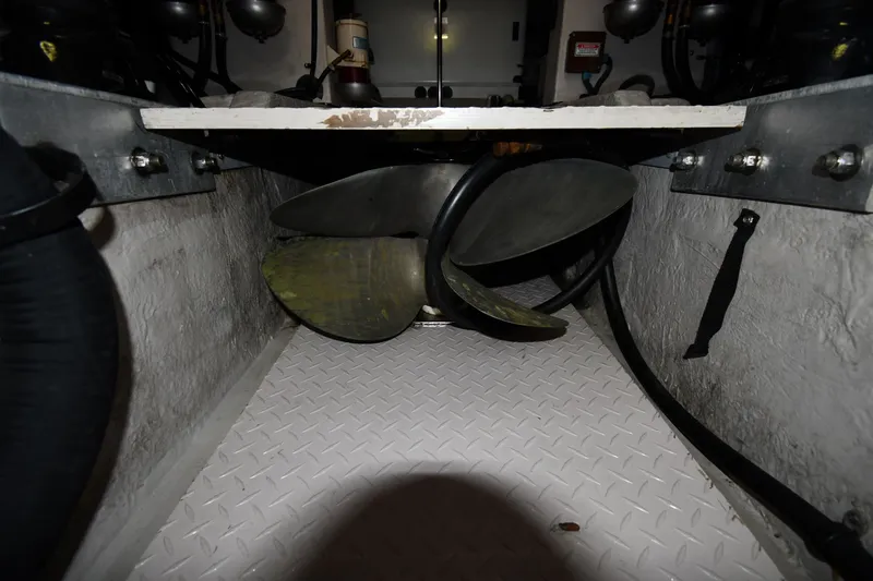 Slide: The Image of Engine room of 2001 Sea Ray 540 Sundancer with visible propeller and mechanical components. - 72