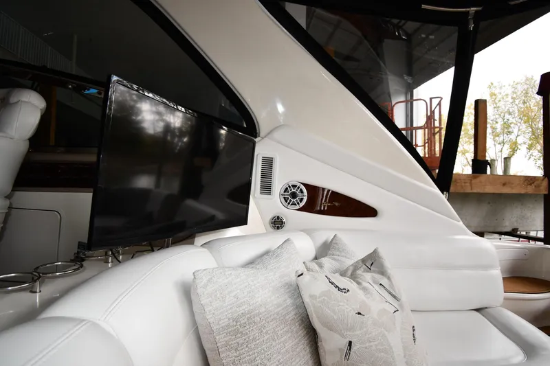 Slide: The Image of Luxurious interior of 2001 Sea Ray 540 Sundancer yacht with plush seating and TV. - 73