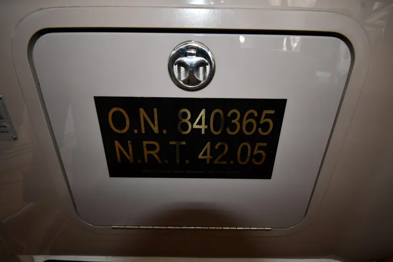 Slide: The Image of 2001 Sea Ray 540 Sundancer boat registration number plate with lock. - 75